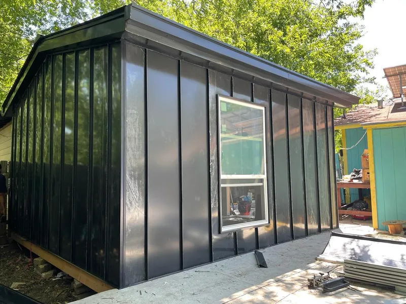 Black standing seam metal wall panels for Roof Inspection in La Grange